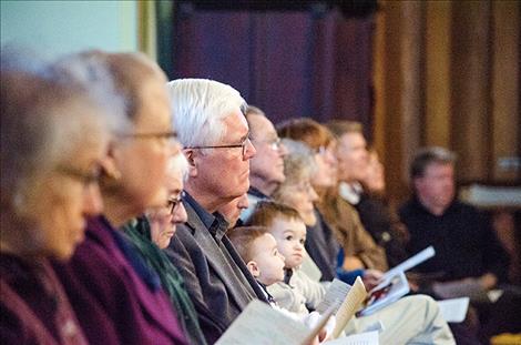 The  audience watches  the performance.