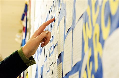 Students share experiences with suicide and mental health issues on a bulletin board.   