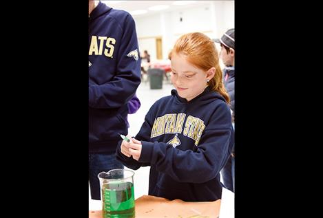 Junior 4-H member Alexa Youngren prepares her syringe at the 2018 Quality Assurance Workshop.