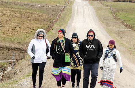 Lauren Chief Elk, Marita Growing Thunder, Shannon Ahhaitty, Erica Shelby and Kyan Bishop walk on the back roads near St. Ignatius to raise awareness about the issue of missing or murdered indigenous women. 