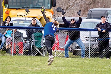 MAC Bulldog Sierra Hutchin robs a homerun from a Loyola batter.