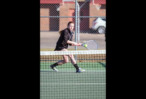 Polson Lady Pirate Shea McGuinness runs down a serve during her match against Libby.