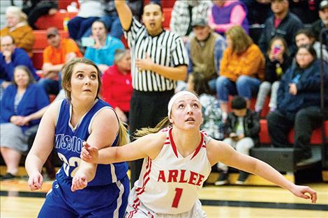 Arlee Scarlet Noelle West and Mission Lady Bulldog Leila Marsh battle for a rebound.