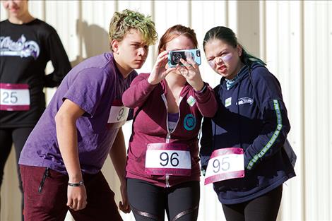 A trio of runners take a selfie before the big race.