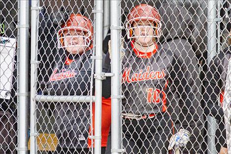 Ronan Maidens Emilie Corley (10) and Marissa Mock (18) cheer on their teammates from the dugout.
