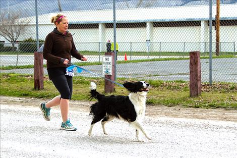 Kathryn McEnery, of Hot Springs, and her furry companion set out on a half-marathon adventure.