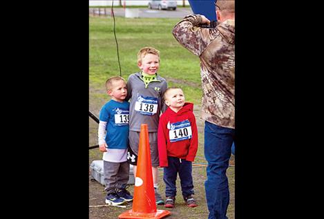  Mile fun-run  winner Cody Katzer (138) takes a moment for a  post-race picture with brothers Waylon Katzer (139) and Cash Katzer (140).