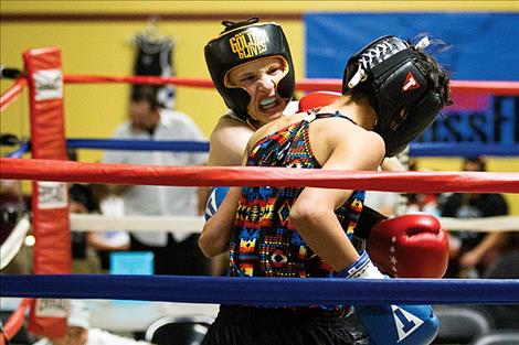 Kellan Norman lands a punch on the chin of his opponent.