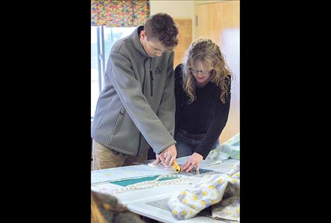 MVCA student Joe Brown works at the cutting table.