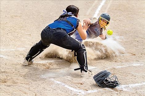 MAC Bulldog Azia Humphrey defends the plate. 