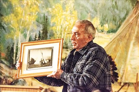 Local resident Wyman  McDonald shows a photo  of Sundown, his cousin.