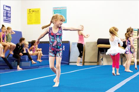 JoHanna Long, above, dances during a floor exercise.