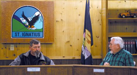 St. Ignatius Mayor Charley Gariepy and council member Mack McConnell havea brief discussion about the town's next water project prior to Tuesday’s meeting.