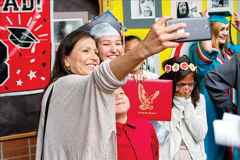 Nikki Burke and family take a  moment for a  smile and  a selfie.