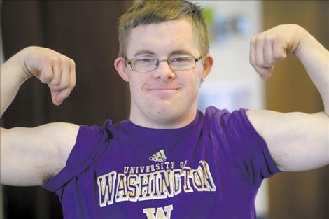 Special Olympian David McCullough shows off his “guns” after a set on the bench press. McCullough, a recent graduate of Charlo High School, will participate in the regional games in Missoula next week.