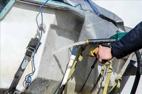 Inspectors use water at 140 degrees to wash boats brought in from states with mussel infestations to help protect local waters.  