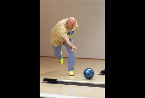 Brian Dinsmore rolls the ball in the bowling competition.