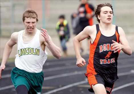 Jaden McNair speeds by a Lincoln runner.