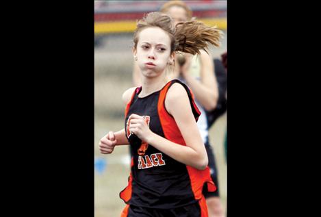 Alexia Pierre rounds the track during the Ronan Invitational.