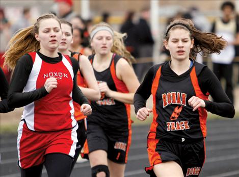 Ronan-St. Ignatius runner Kaylie Durglo strides past competitors during the Ronan Invitational last month.