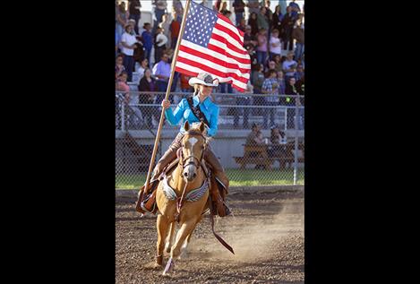 2017 Northwest Montana Pro Rodeo Queen Kayla Seaman enters the arena with Old Glory.