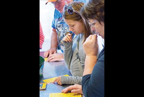 Visitors to Flathead Lake Cheese partake of some of the samples.