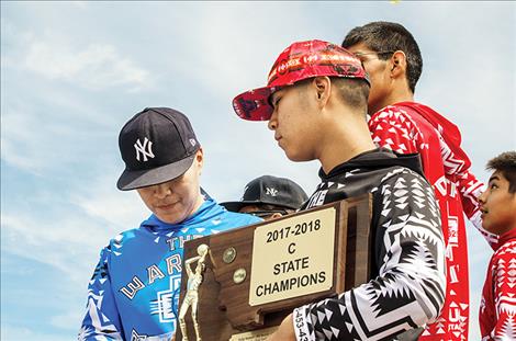 The Arlee Warriors ride on a float during a Fourth of July  parade to bring awareness to suicide prevention and  continue to be role models in the community. 