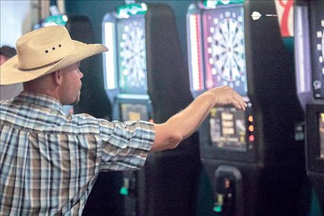 Randy Hemmah competes in the inaugural Darts on the REZ tournament.