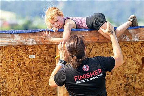 Madison Basler receives a helping hand from mom Katie Basler.