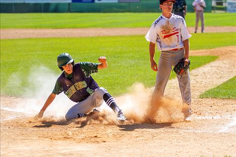 Bryant Hales slides in for a score.
