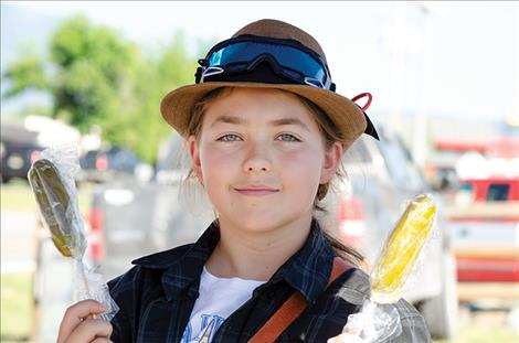 Dylan Schock sells pickles on a stick.