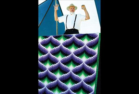 Handmade quilts of all colors are sold at the  Annual Amish  Community  Auction along with hundreds  of other items.