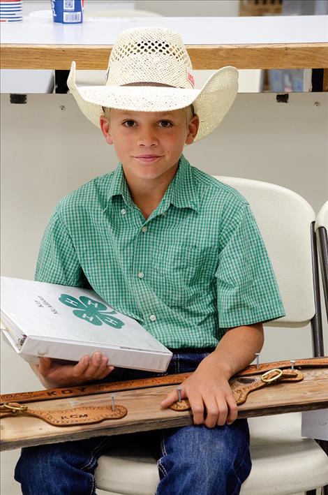 Koy  McAllister, 11, waits to share his leather work with a judge on Monday. 