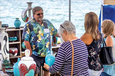 Shoppers connect with regional artists along Flathead Lake during last weekend's Festival of Art in Sacajawea Park.