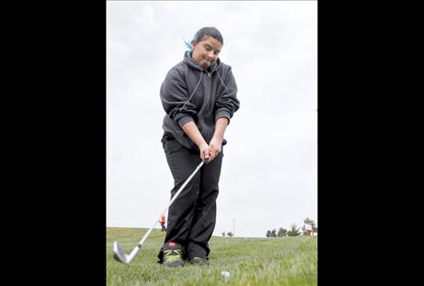 Sophomore Mariah Quintana concentrates as she plays the 18th hole during the Ronan Invitational last week.