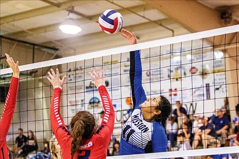 Lady Bulldog Addison Arlint taps the ball over the net.