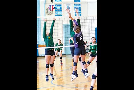 Lady Viking Destiny Manuel battles at the net.