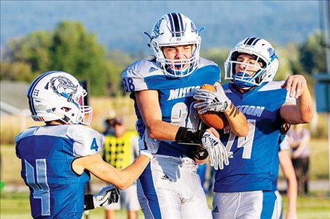 Bulldog Jedi Christy (#88) celebrates a touchdown with  teammates.