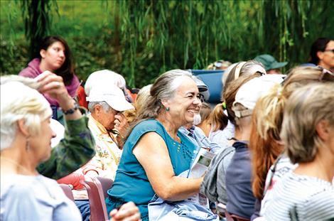  The audience enjoys the play.