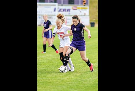 Lady Pirate Ashlee Howell battles a defender for the ball during their 11-2 tromping of Frenchtown on Thursday, where Howell scored twice.