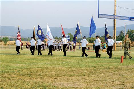 The  Mission Valley Honor Guard presents  the colors. 