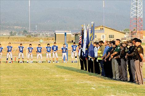 The Mission Valley Honor Guard, local law  enforcement, firefighters, emergency responders and soldiers remember the heroes of 9/11 before a football game on Friday. 