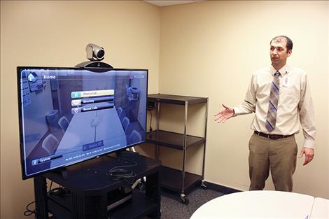 Glendive Medical Center CEO Parker Powell shows off the hospital’s telemedicine system. For the past few years, the hospital has used telemedicine via video to provide mental health services for patients.