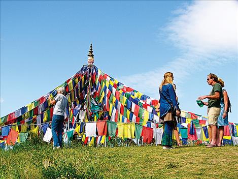 Festival attendees walk around the grounds of the garden.