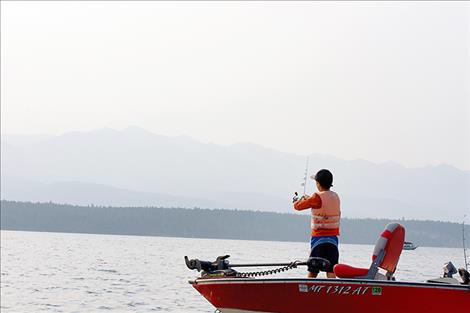 Donovan Beeks casts his line into the lake in hopes of reeling in a mack.