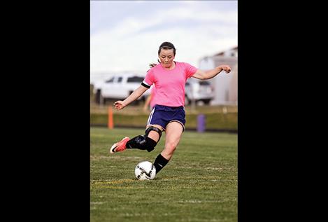 Lady Pirate Ashlee Howell takes a shot on goal.