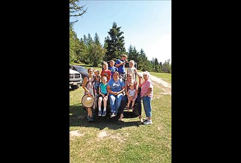 Rhealene Cook-Wilkinson, left, stands for a photo with her family.