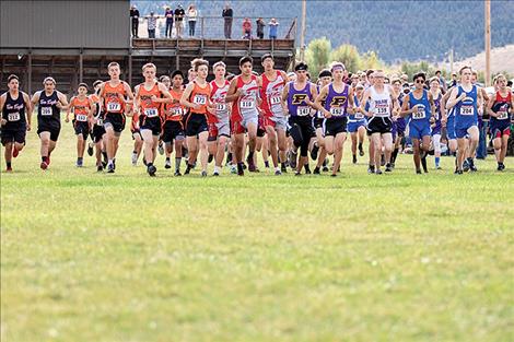 The varsity boys' starting line takes off during the Mission Invite cross-country meet last month.  