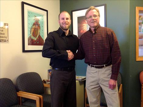 Dr. Ofstad, right, plans to continue seeing patients for many years to come even though he has passed the torch on to Dr. Marcus Simonich.