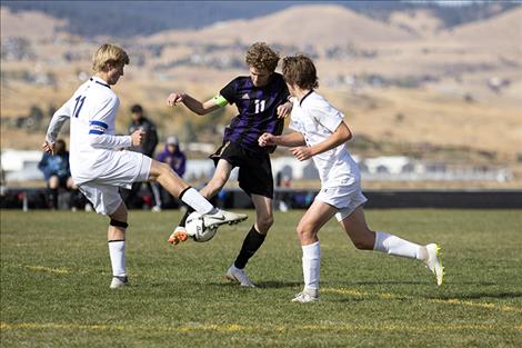 Pirate Robin Erickson battles for the ball.